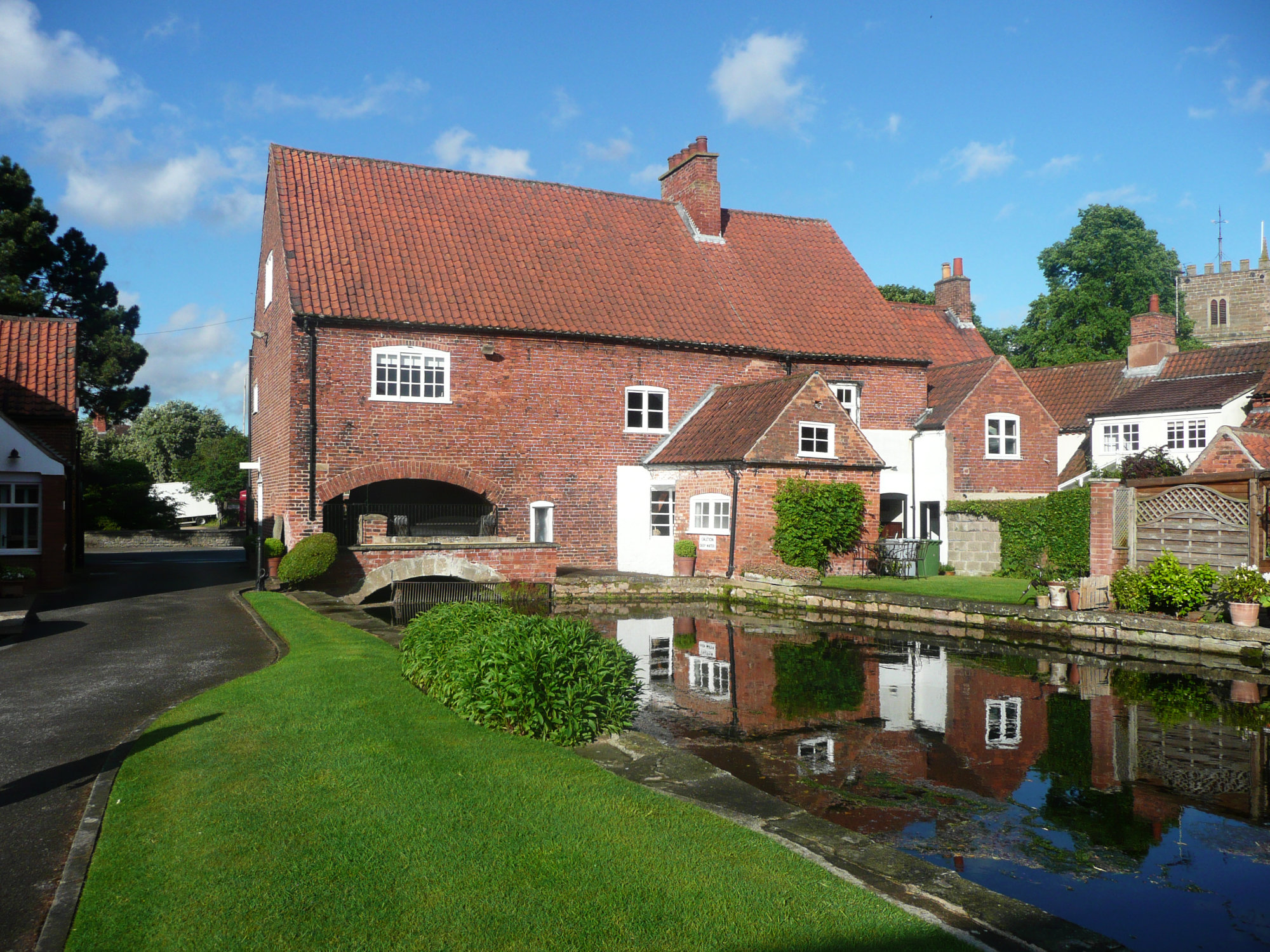 Ollerton Watermill beside the mill pond, photographed in May 2022